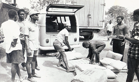Men lifting bags