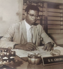 S.C Chigbo at a table